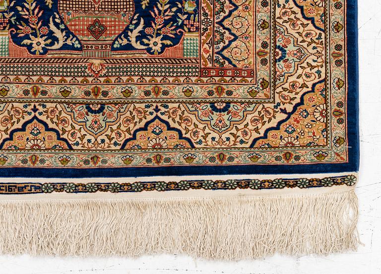 A semi-antique silk Hereke rug, West Anatolia, signed c. 107 x 72 cm.