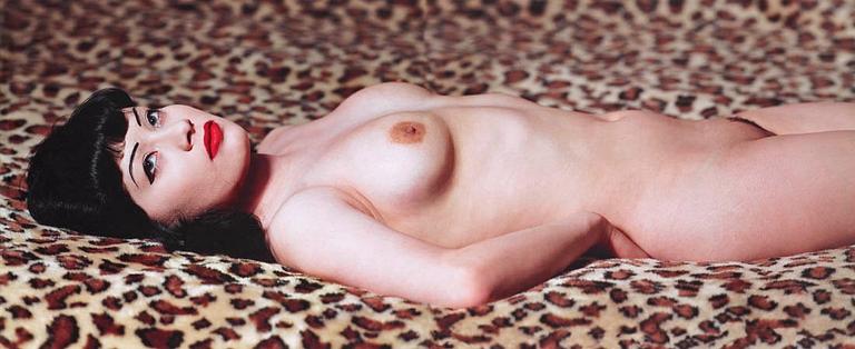 Albert Watson, "Breaunna on Leopard Print Bedspread, Las Vegas Hilton, 2001".