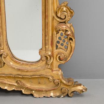 A late 19th century mirror in rococo style.