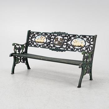 A children's cast iron garden sofa and armchair, mid 20th century.