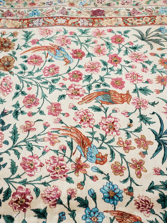 A CARPET, "Golo Bolbol" (="Flower and bird"-motive), a silk Esfahan figural, ca 337 x 243,5 cm, Mohammad Seirafian.