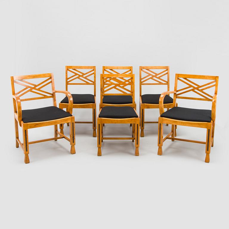 A 1920s/30s century dining table and set of 6 + 2 chairs.