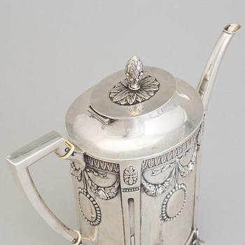A set of three silver objects (coffeepot, creamer and sugarbowl, CG Hallberg and GAB, Stockholm 1907. Weight ca 1226 gr.