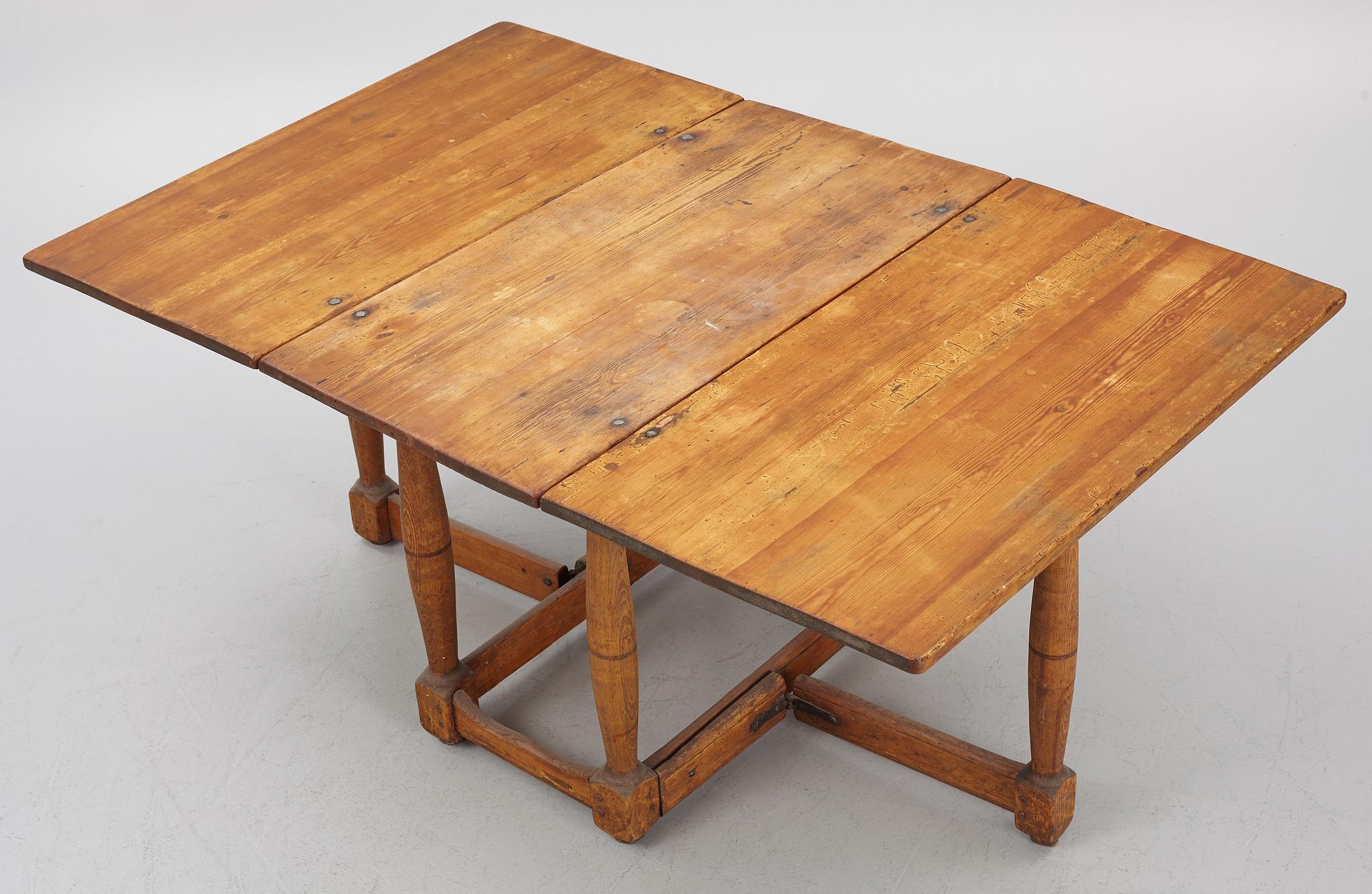 A drop-leaf table, 18th Century.