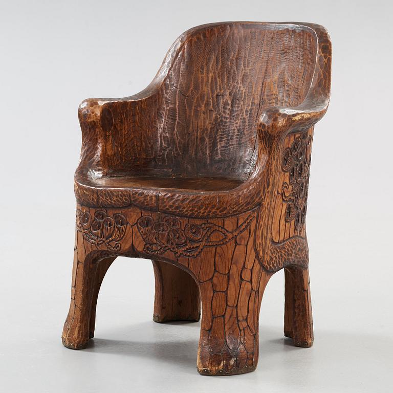 A Gustaf Fjaestad Art Nouveau carved pine chair 'Stabbestol', by Adolf Swanson, Arvika, Sweden 1908.