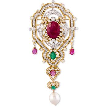 134. A BROOCH / PENDANT, 18K white and yellow gold, rubies, emeralds, diamonds, cultured pearl. Iran.