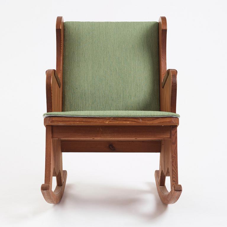 Nordiska Kompaniet, a Swedish Modern stained pine 'Lovö' rocking chair, 1940s.