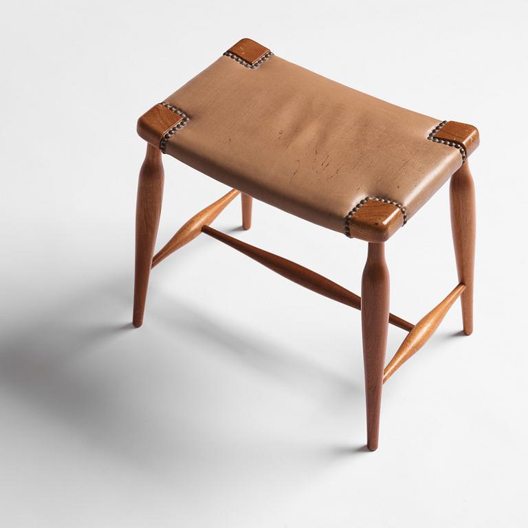 Josef Frank, a mahogany and leather upholstered stool, model 967, Svenskt Tenn.