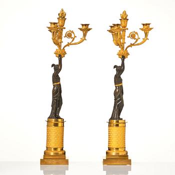 A pair of French Empire four-light candelabra, attributed to Francois Rabiat (bronze maker in Paris 1756-1815).