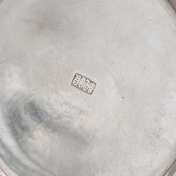 A set of three Japanese silver coasters and a pair of salts with shakers, 20th century.