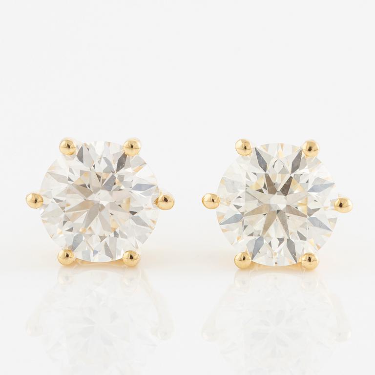 Örhängen 18K guld med briljantslipade diamanter.