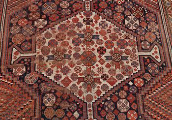 An antique Khamseh carpet, South western Iran, c 352 x 178 cm.