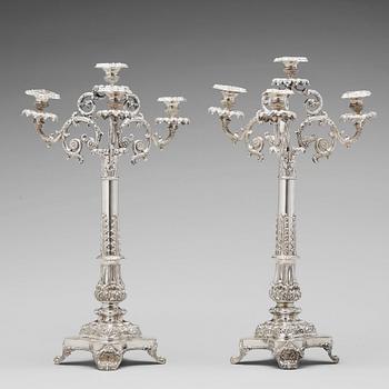 180. Gustaf Möllenborg, kandelabrar för fyra ljus, ett par, silver, Stockholm 1838. Empire.