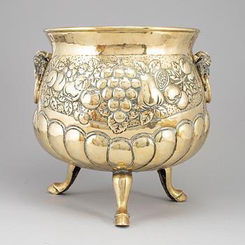 A 19th century brass champagne cooler.