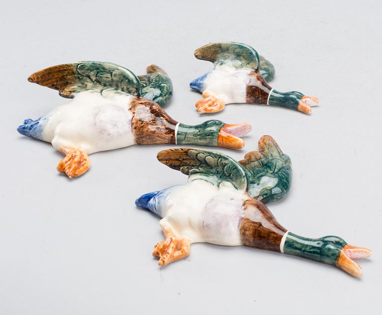 A SET OF THREE ROYAL DUX FLYING DUCKS.