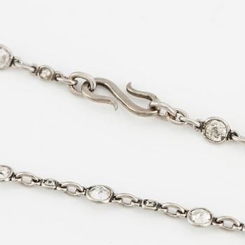 An antique platinum diamond long chain.