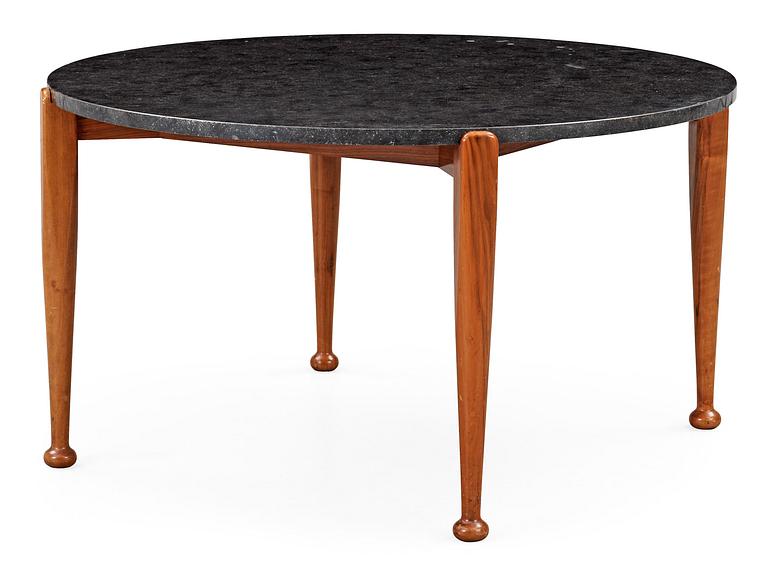 A Josef Frank black stone top table on a walnut base by Svenskt Tenn model 965.