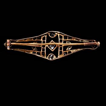 BROSCH, silver/guld, rubiner och diamanter , 1900-talets första hälft.