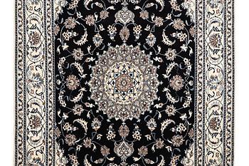 A carpet, Nain, part silk, ca 307 x 198 cm.