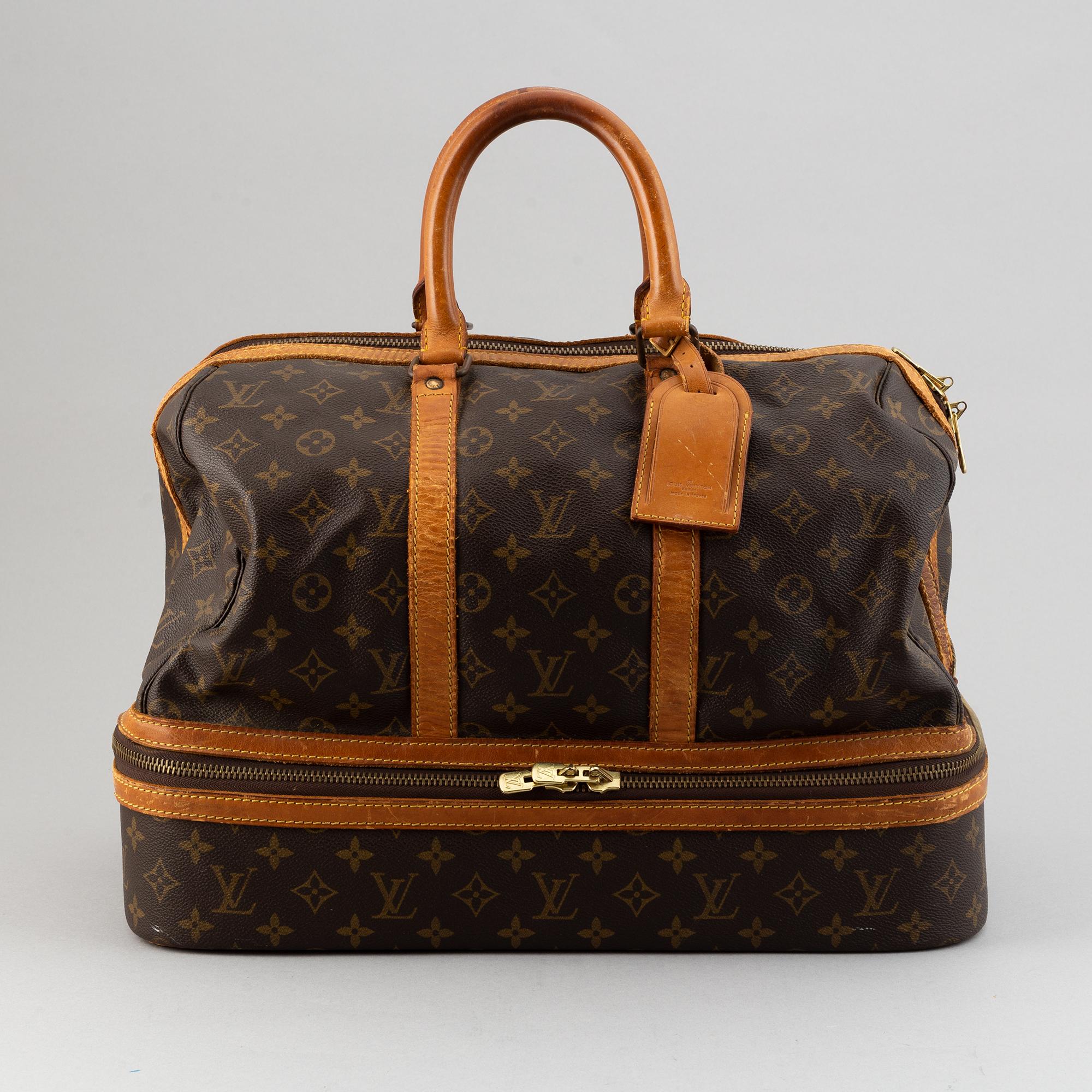 Louis Vuitton, a monogram canvas weekend bag.