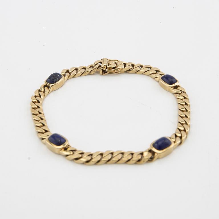 Bracelet curb chain 14K gold with Lapis Lazuli.