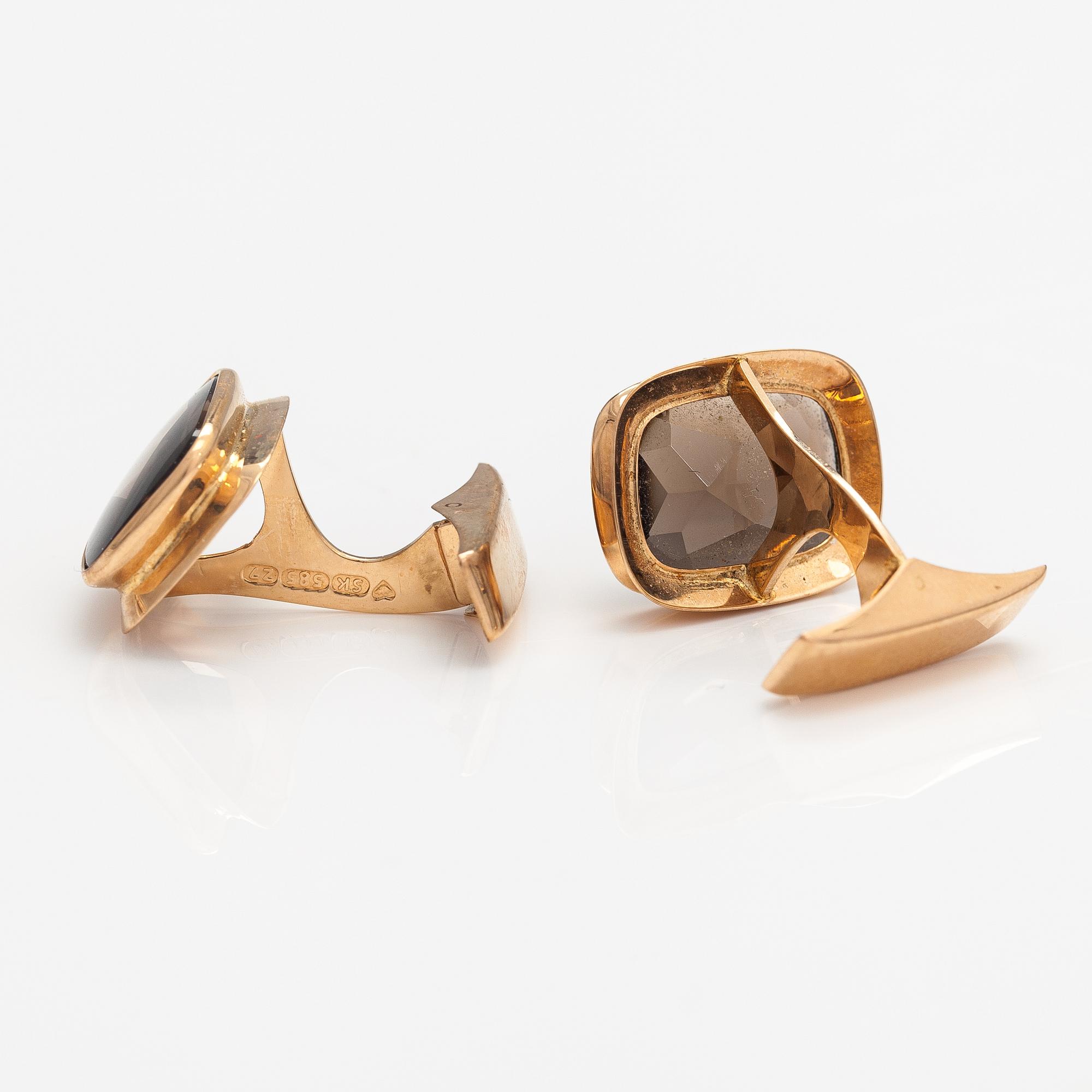 A pair of 14K gold cufflinks with smoaky quartzes. Liitola & Koistinen kultasepät, Turku 1977.