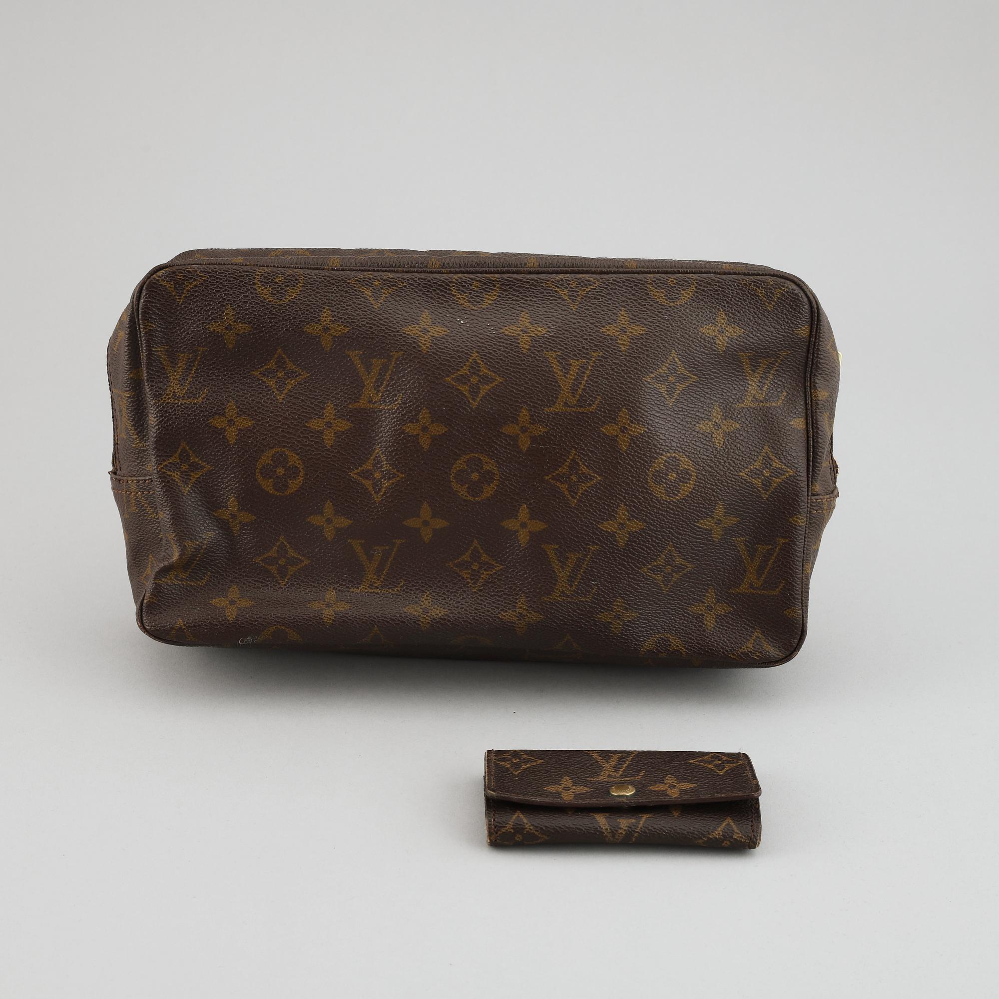 LOUIS VUITTON, a 'Trousse toilette 28' toilet bag and a key case.