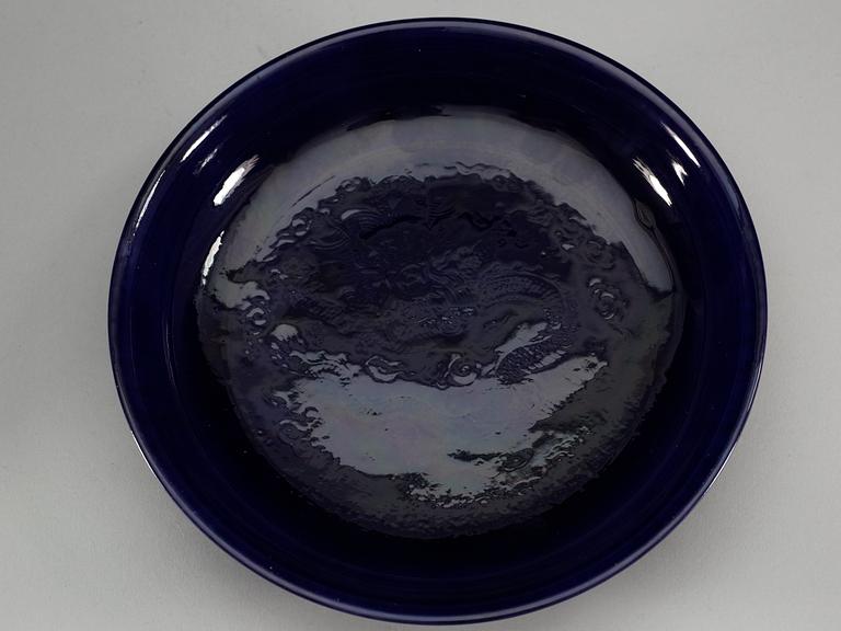 A pair of deep purple glazed dishes, Qing dynasty, with Qianlong six character mark.
