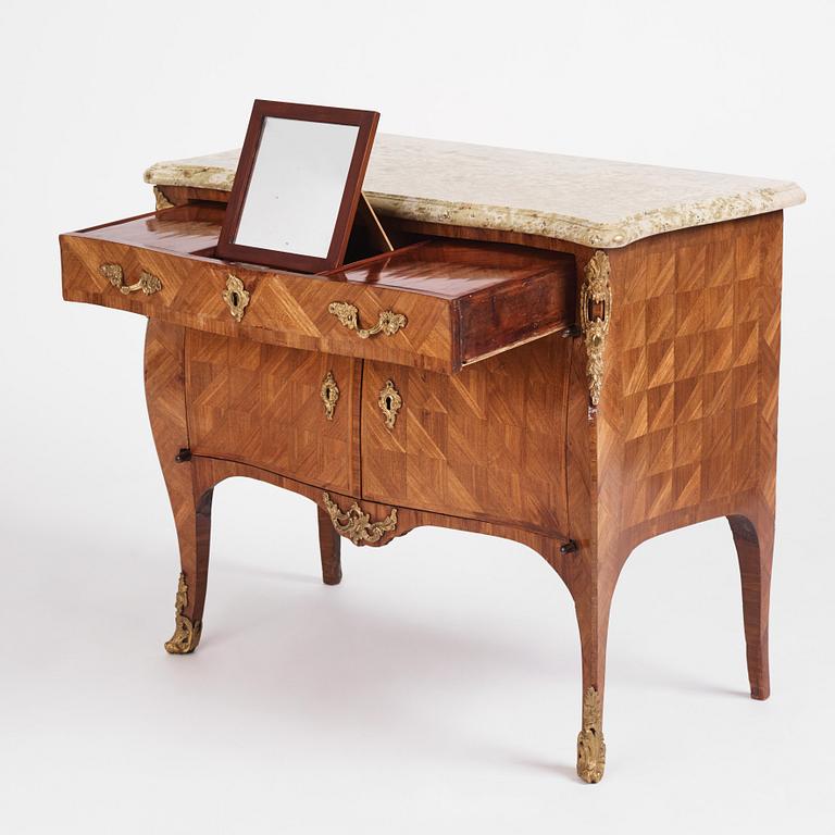 A Swedish rococo parquetry and ormolu-mounted commode, later part of the 18th century.