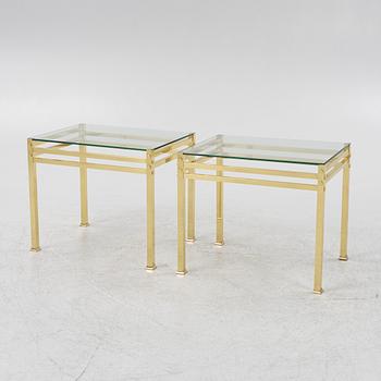 A pair of glass top bedside tables, second half of the 20th century.