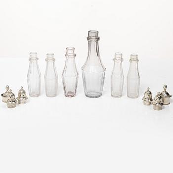 Parts for a table centrepiece, six glass bottles, and seven lids in silver, marked Pehr Zethelius, Stockholm 1807.