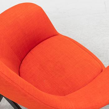 A 'Benarp/Genua easy chair with foot stool from Ikea,.