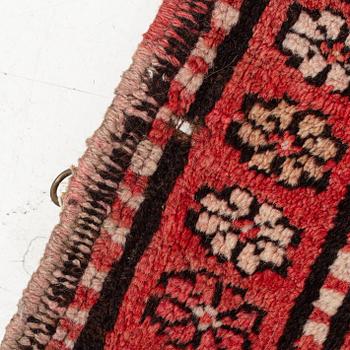 An oriental semi antique carpet, circa 272 x 120 cm.