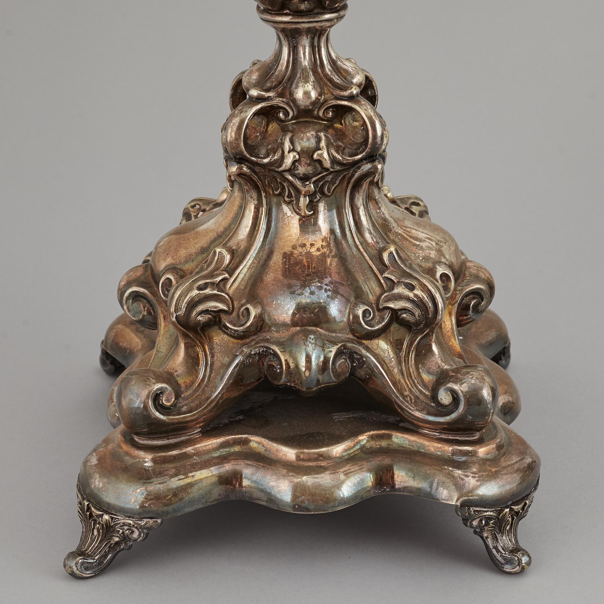 A pair of barocque style nine lights candelabra, silver plate, 20th Century.