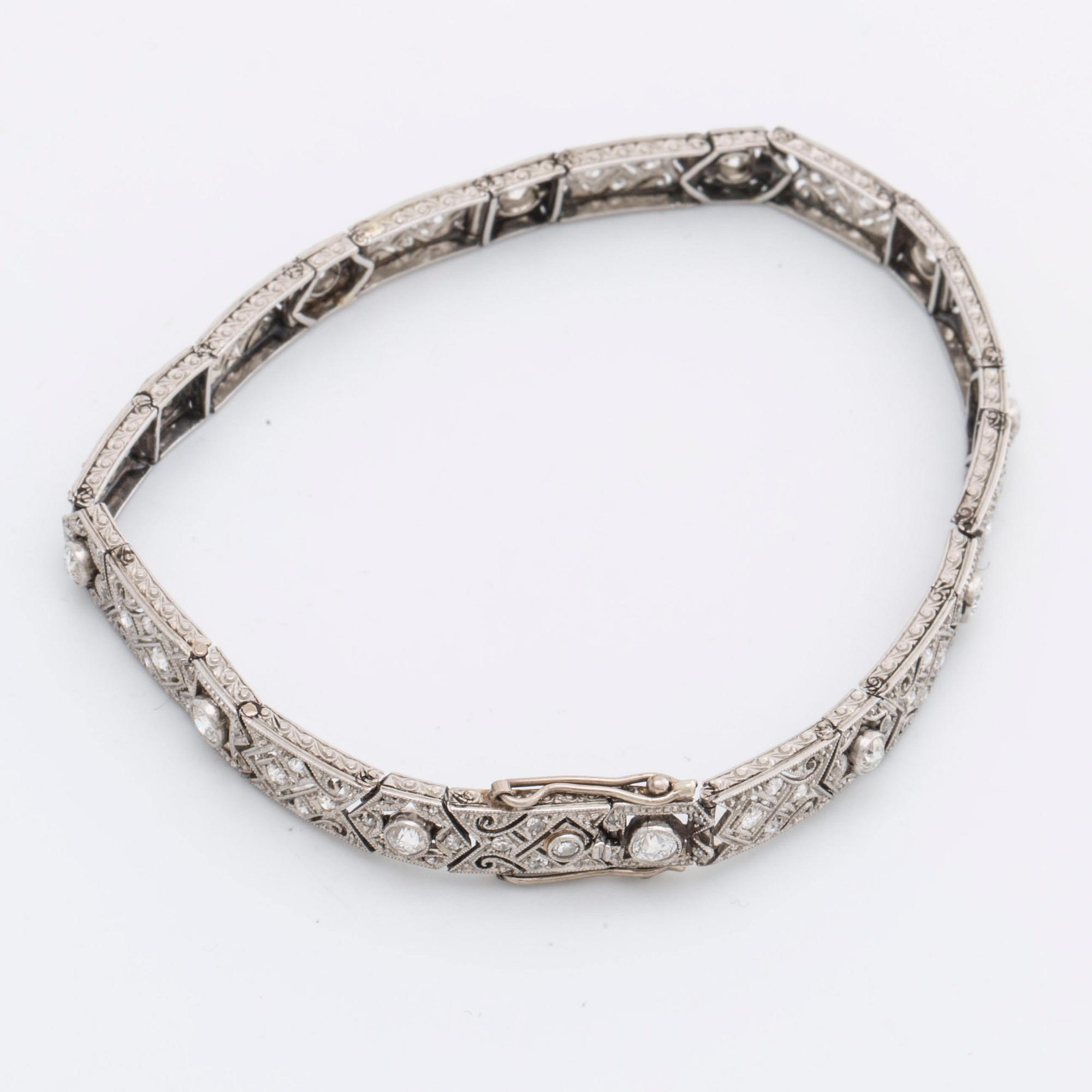 DIAMOND BRACELET, probably platinum, old and rose-cut diamonds approx 2 ct in total, 1 large stone not diamond.