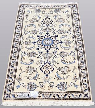 Two Nain rugs, part silk, ca 132 x 74 cm.