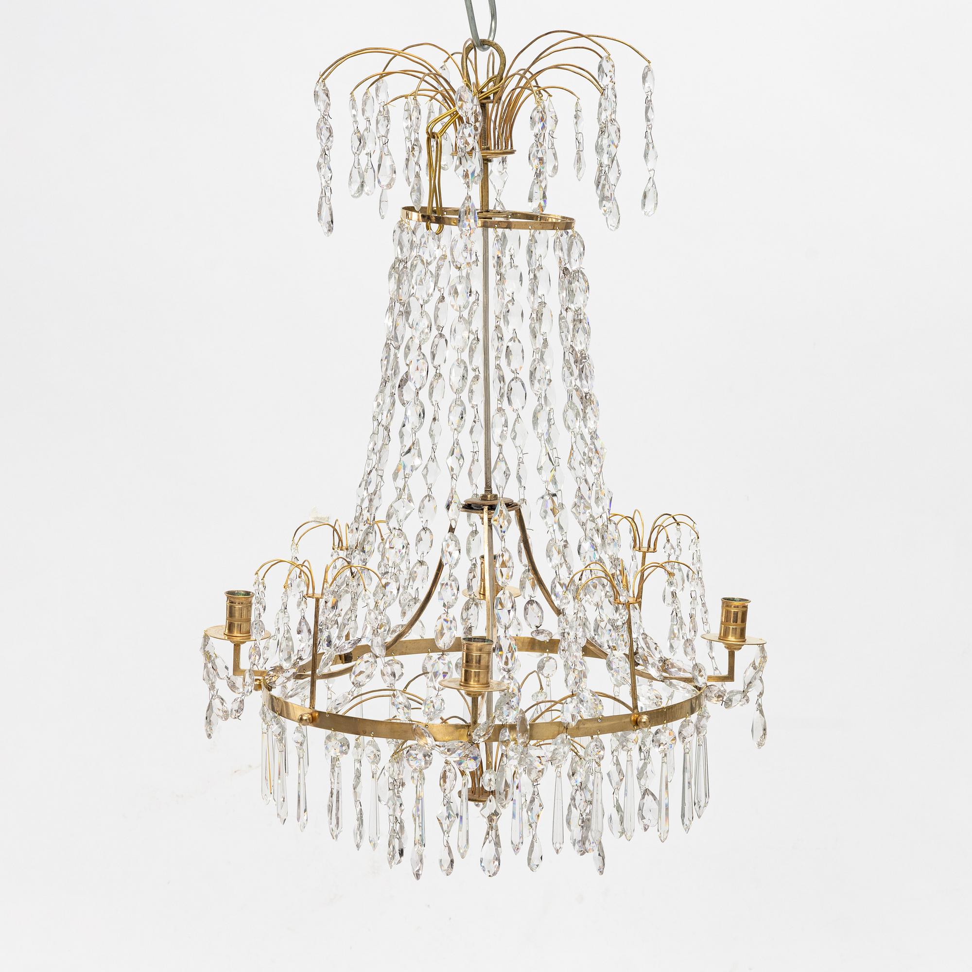 A Gustavian four-branch gilt-brass chandelier, Stockholm, late 18th century.