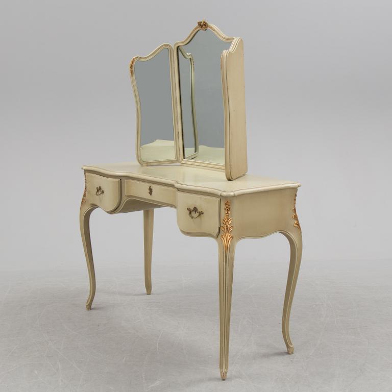 A mid 20th century Rococo style dressing table, a pair of bedside tables and one stool.