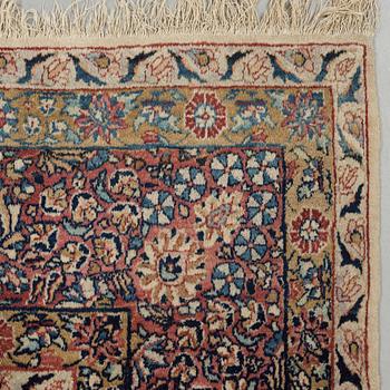 A semi-antique/old Kerman carpet, around 361 x 264 cm.