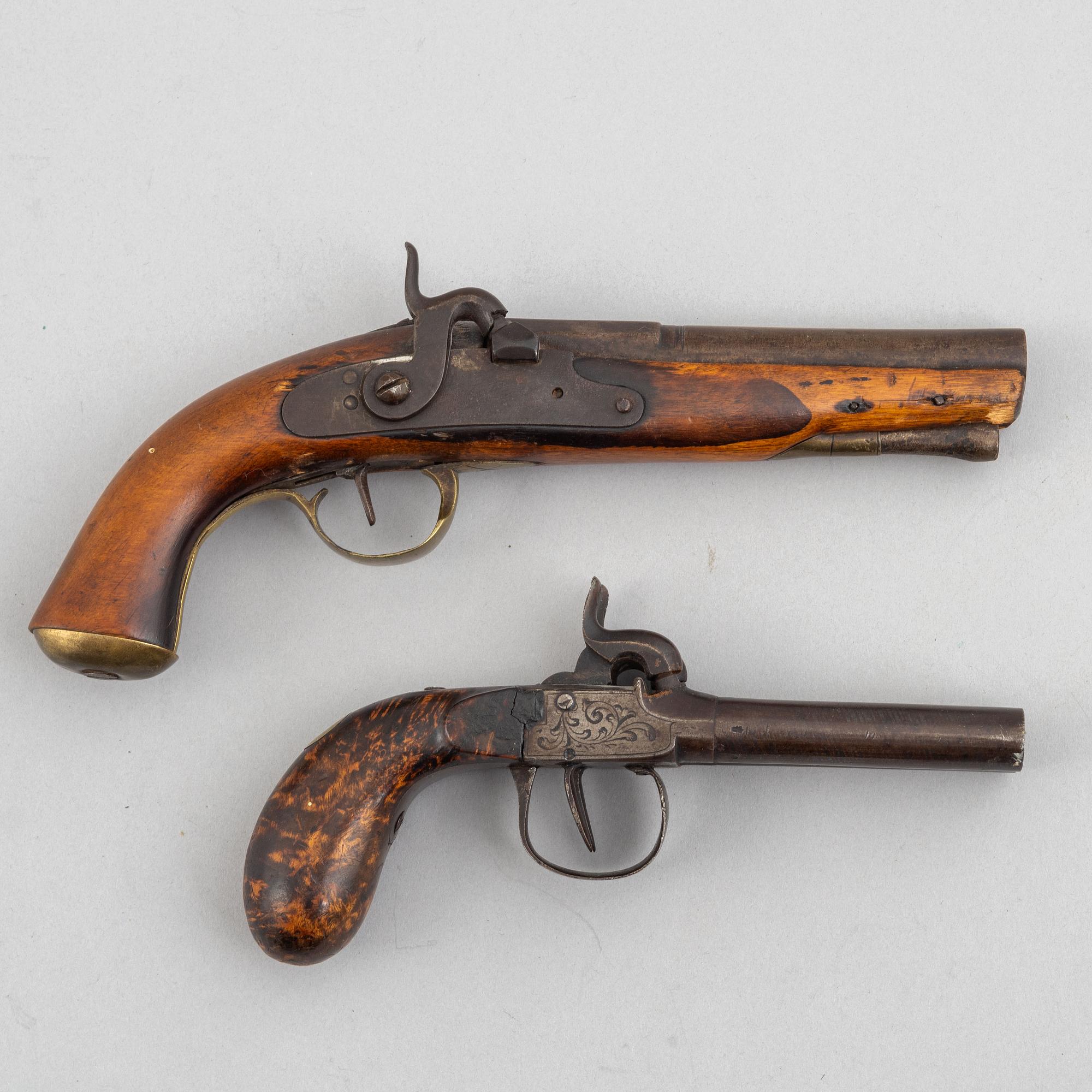 Two 19th century percussion pistols.