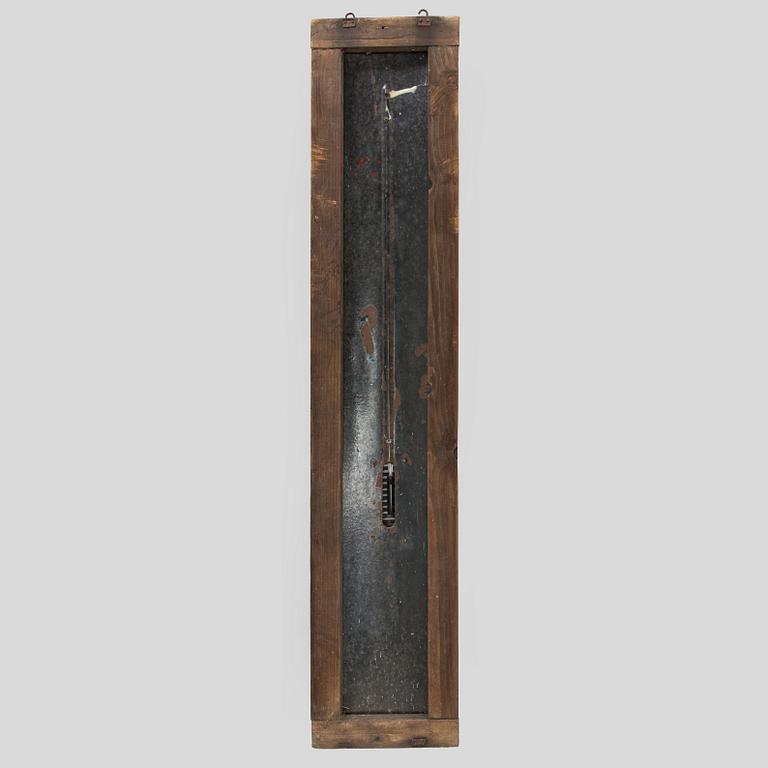a mid-20th century outdoor thermometer.