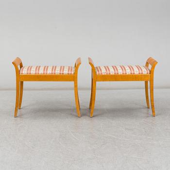 a pair of stools from the first half of the 20th century.