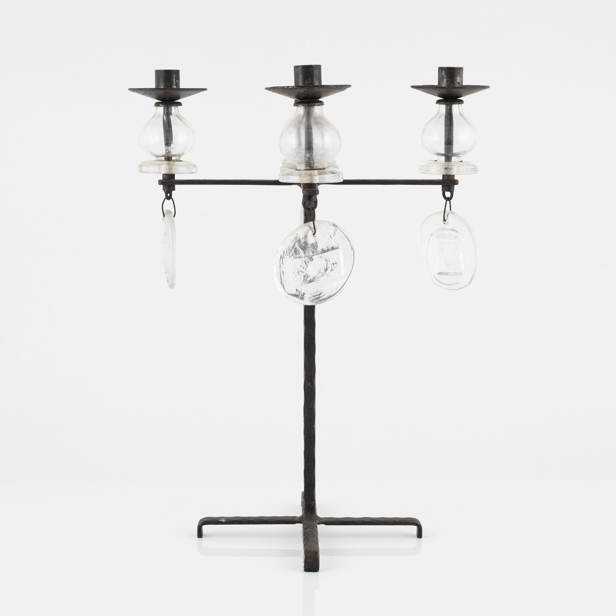 Erik Höglund, a iron and glass candelabra.
