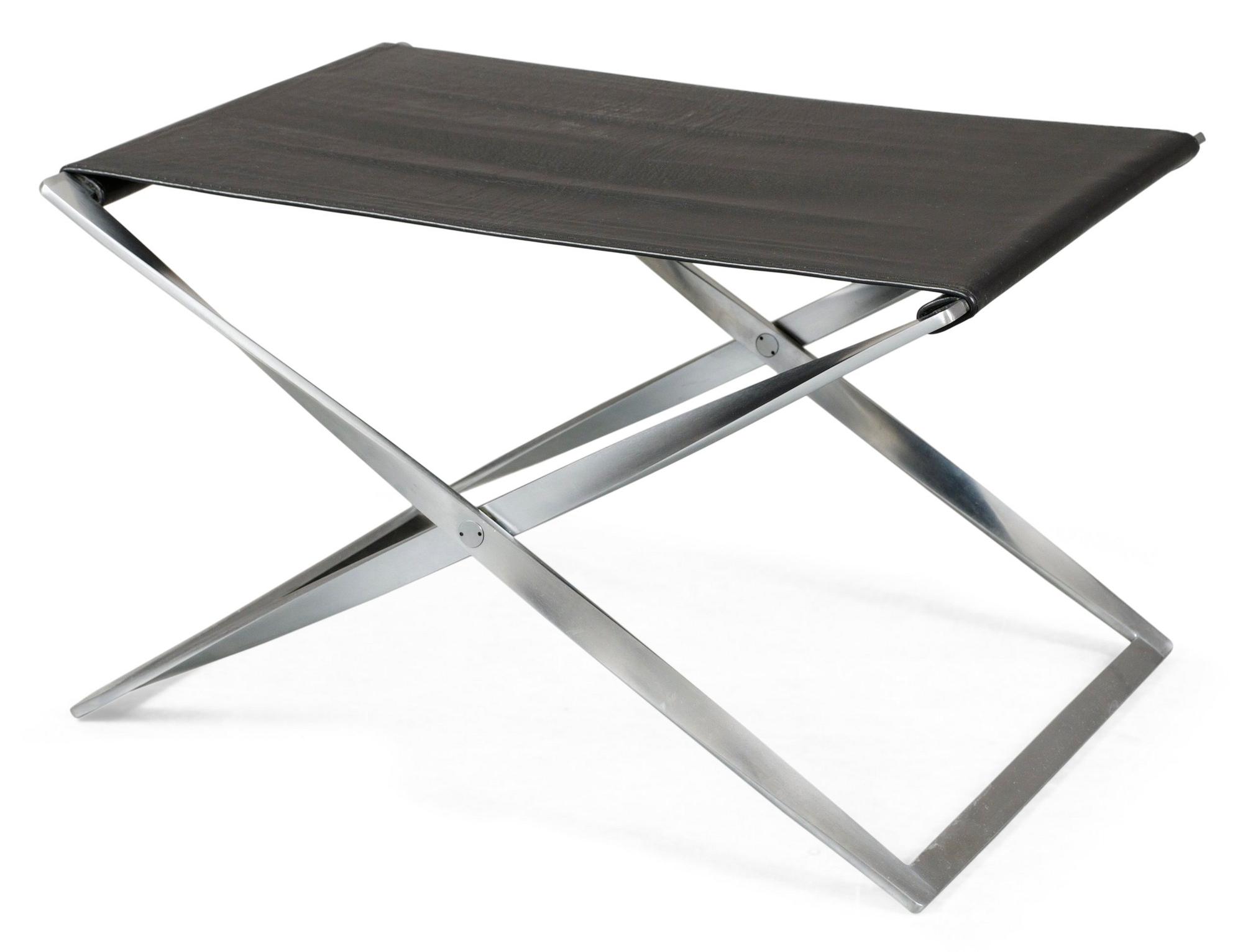 A Poul Kjaerholm folding stool by Fritz Hansen, Denmark. Black leather and matpolished steel.