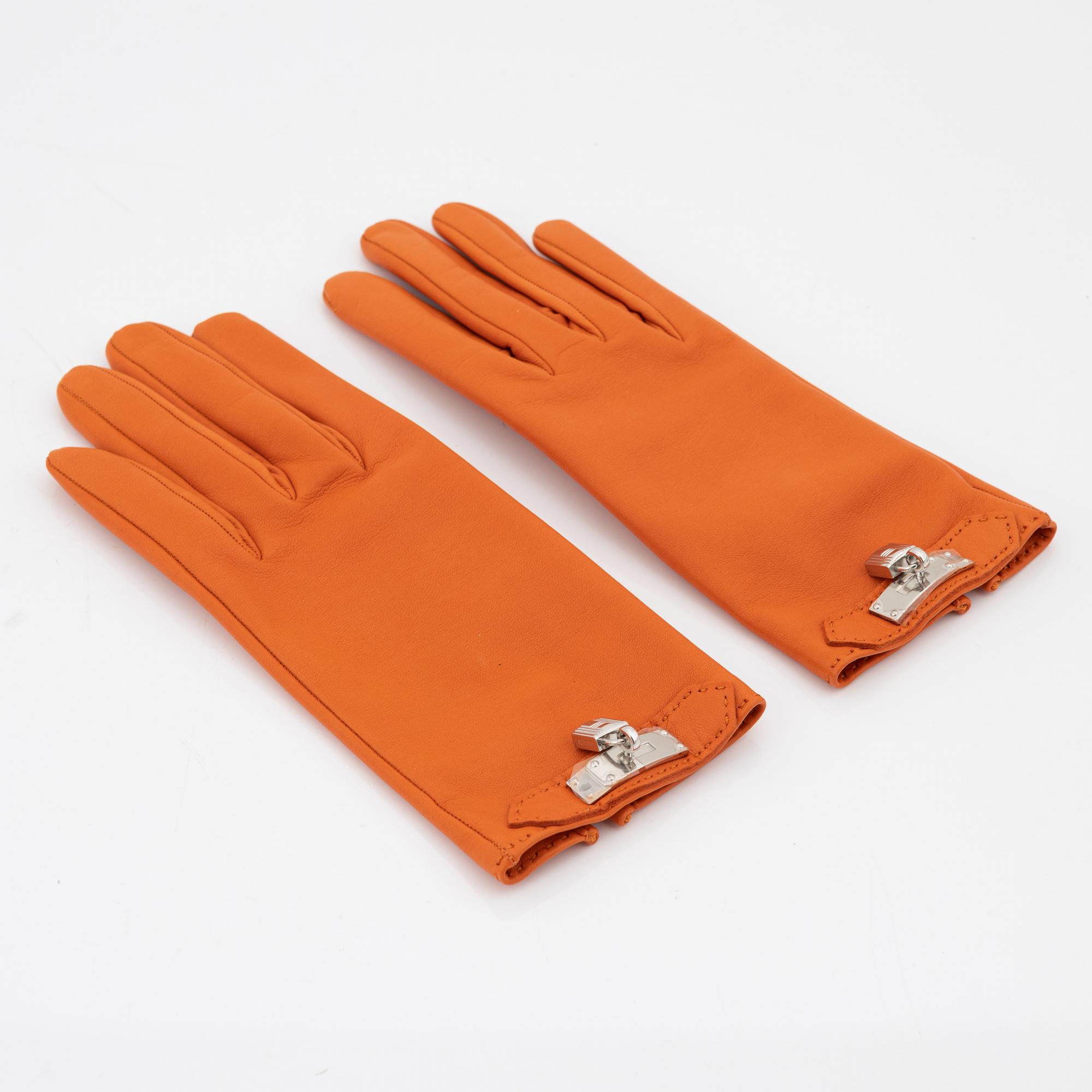 Hermès, a pair of orange kidskin and lambskin gloves, french size 8.
