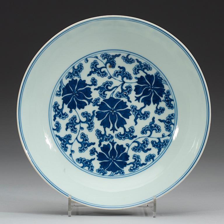 A set of four blue and white lotus dishes, Qing dyanasty with Qianlong sealmark.