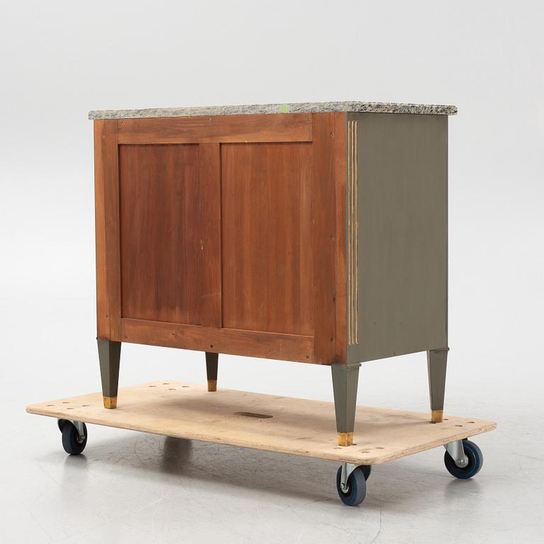 A painted Gustavians style chest of drawers with stone top, first part of the 20th Century.