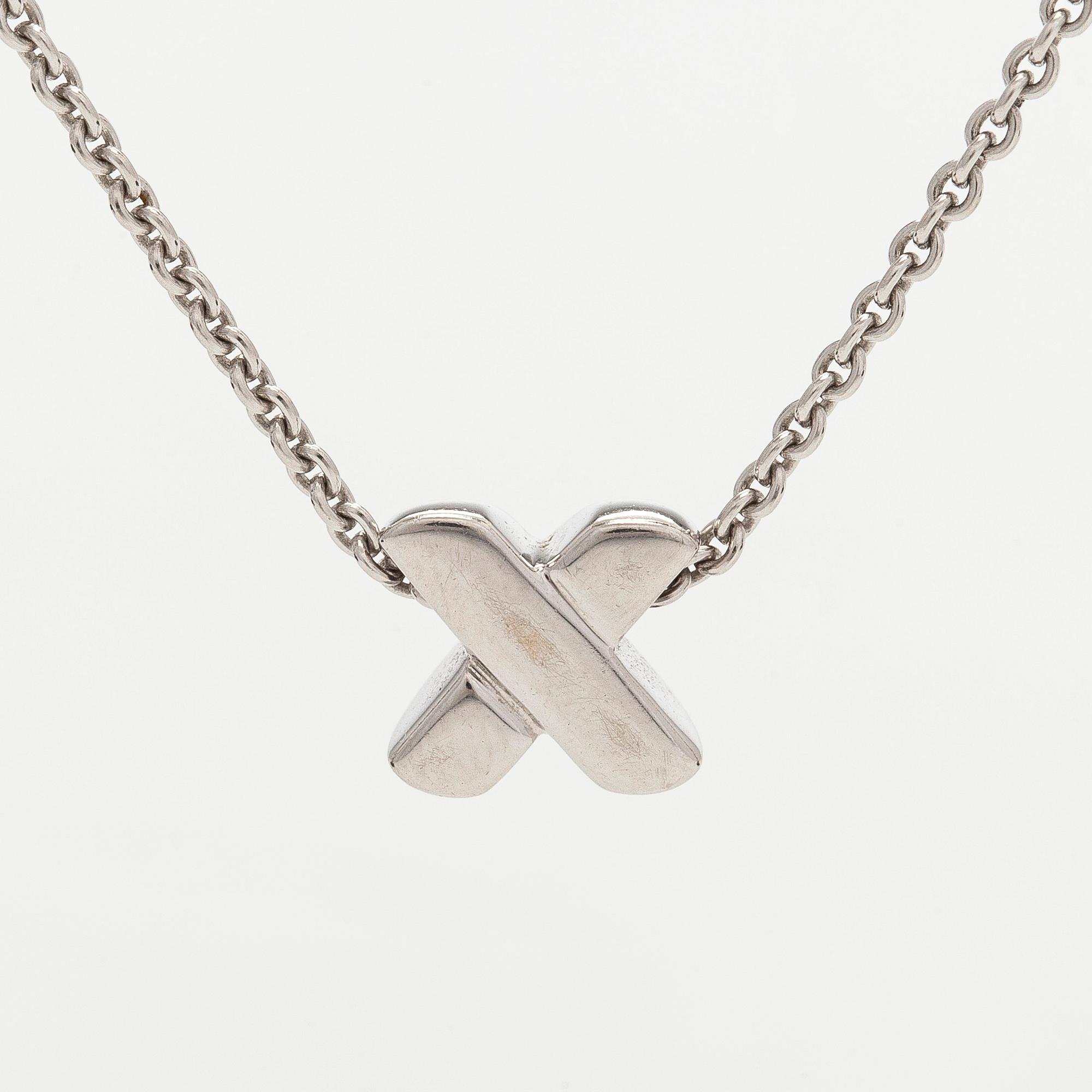 Tiffany & Co, kaulakoru "Cross Stitch", 18K valkokultaa ja timantteja.