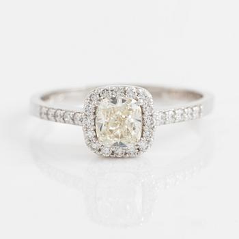 Cushion cut diamond and brilliant cut diamond ring.