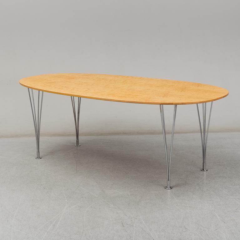 PIET HEIN & BRUNO MATHSSON, a curly birch veneered 'Superellips' table from Mathsson International.